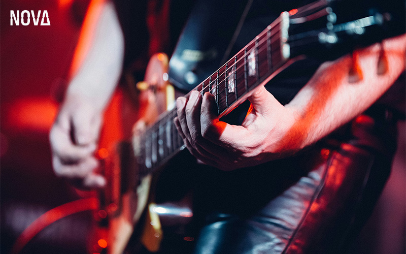 Live guitarist performing at Nova Bar.