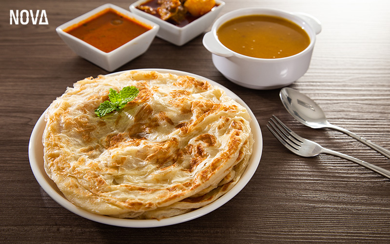 Roti Prata and curry, a late-night snack in Singapore.