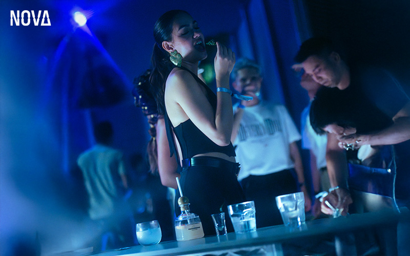 Woman enjoying a night out at NOVA Bar.